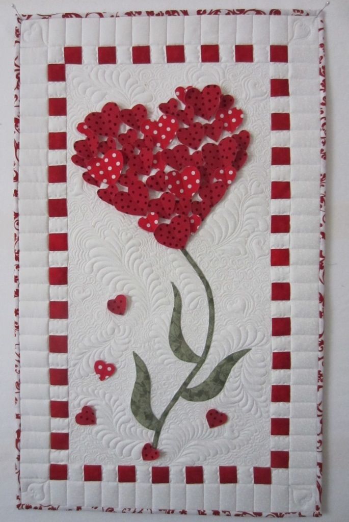 Heart Wall Hanging at Sew Grateful Quilts. The hearts are only stitched down the middle.